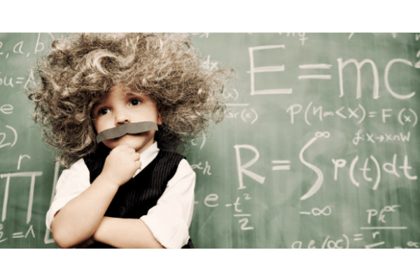 Small boy dressed as scientist Einstein