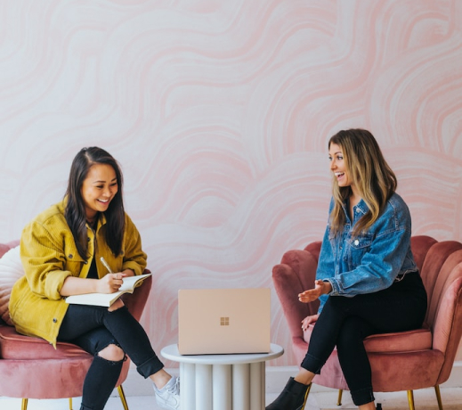 two females and laptop